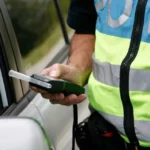 Police Officer Offering a breathalyzer test. Maybe the driver was operating while impaired.